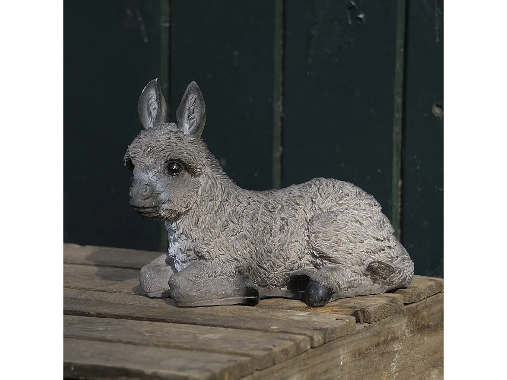 Petit ane décoratif en résine Allongé