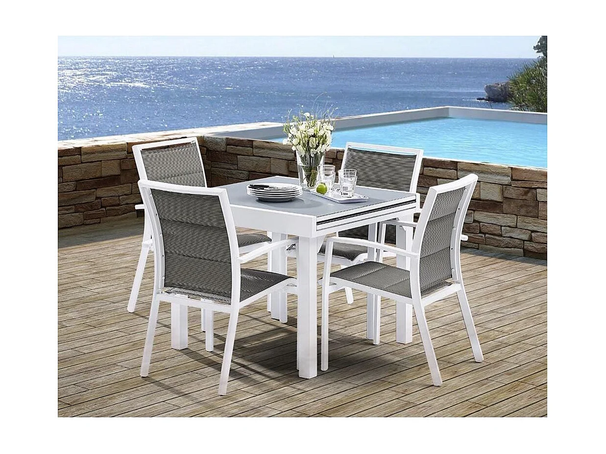 Table Modulo 4/8 personnes structure en aluminium blanche. plateau en verre coloris gris perle