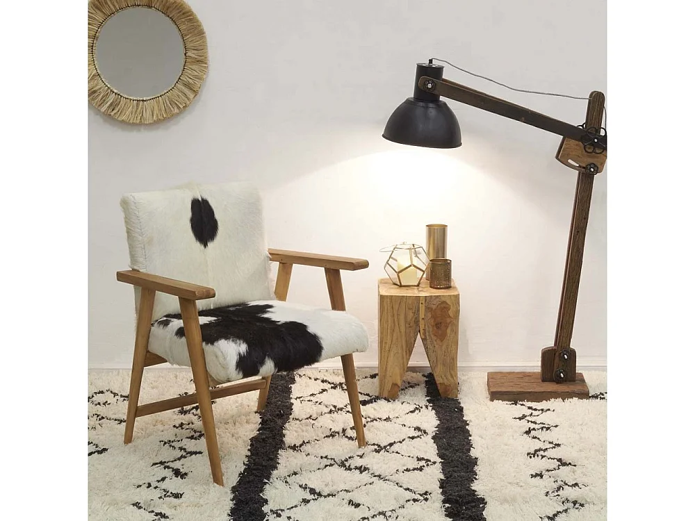 Fauteuil teck avec peau de chèvre noire