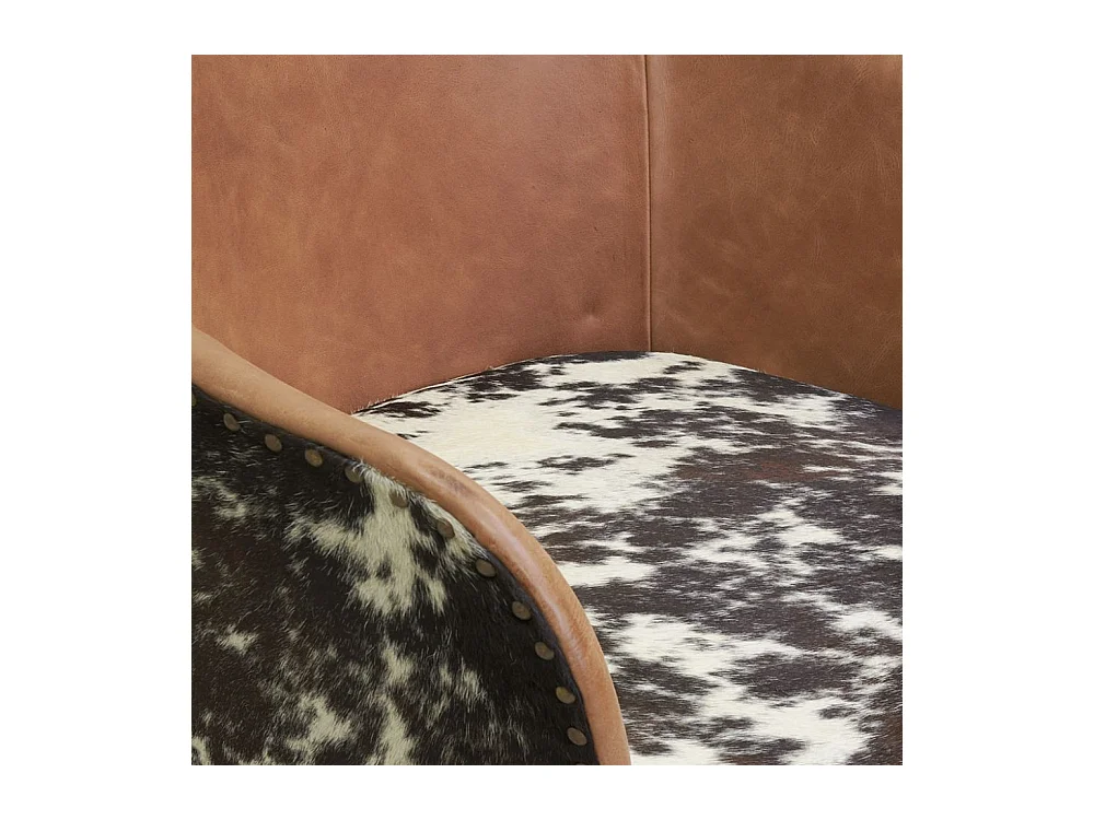 Fauteuil en cuir camel et peau de vache