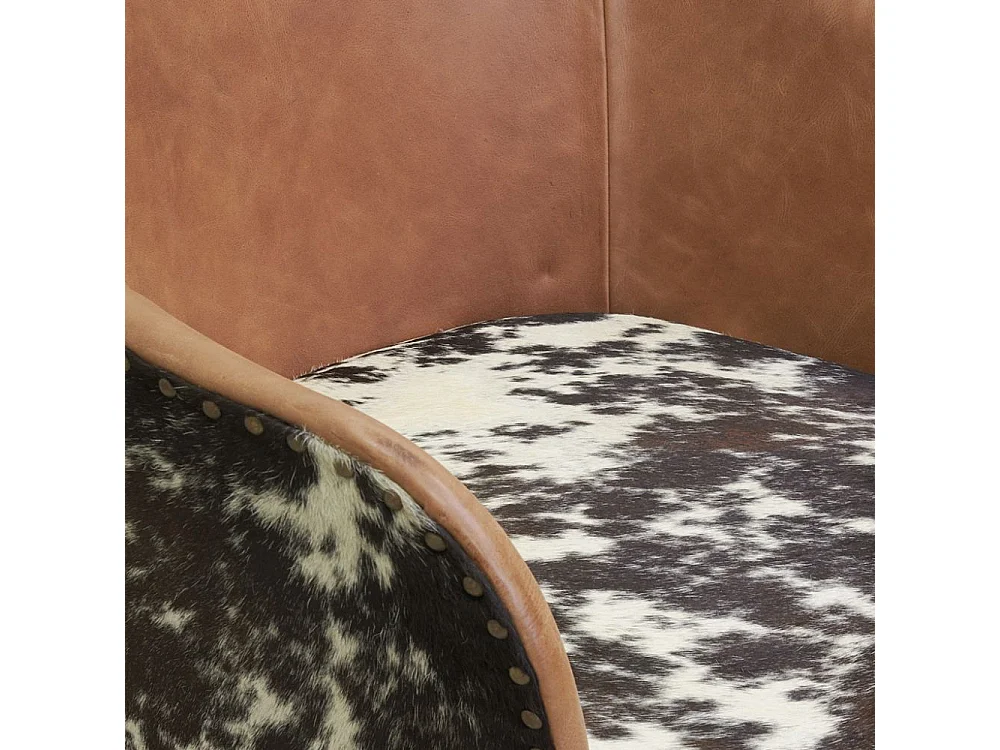 Fauteuil en cuir camel et peau de vache