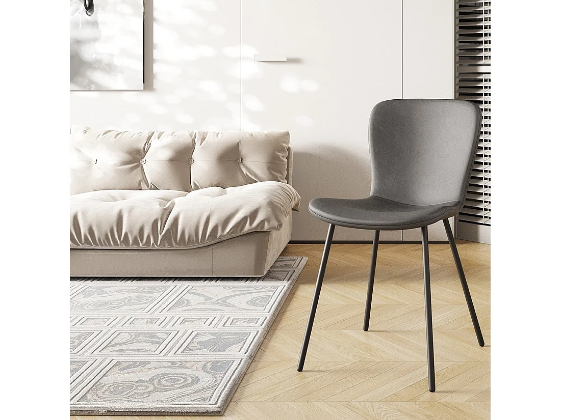 Sedia in pelle PU per sala da pranzo in colore grigio scuro. Collezione ALCAN