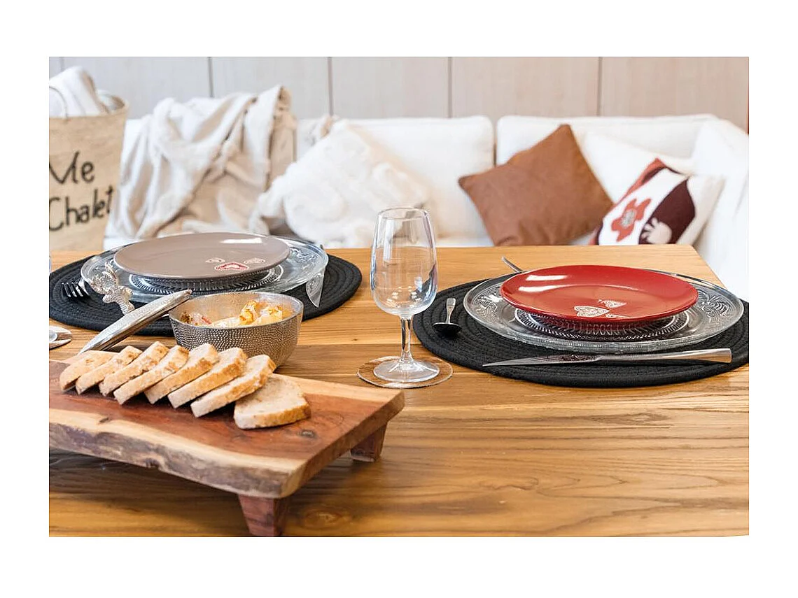 Coussin écru en coton et décor abstrait tissé