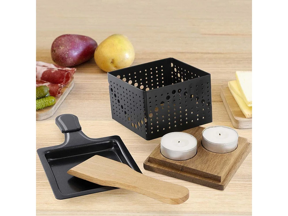 Raclette individual a la luz de las velas