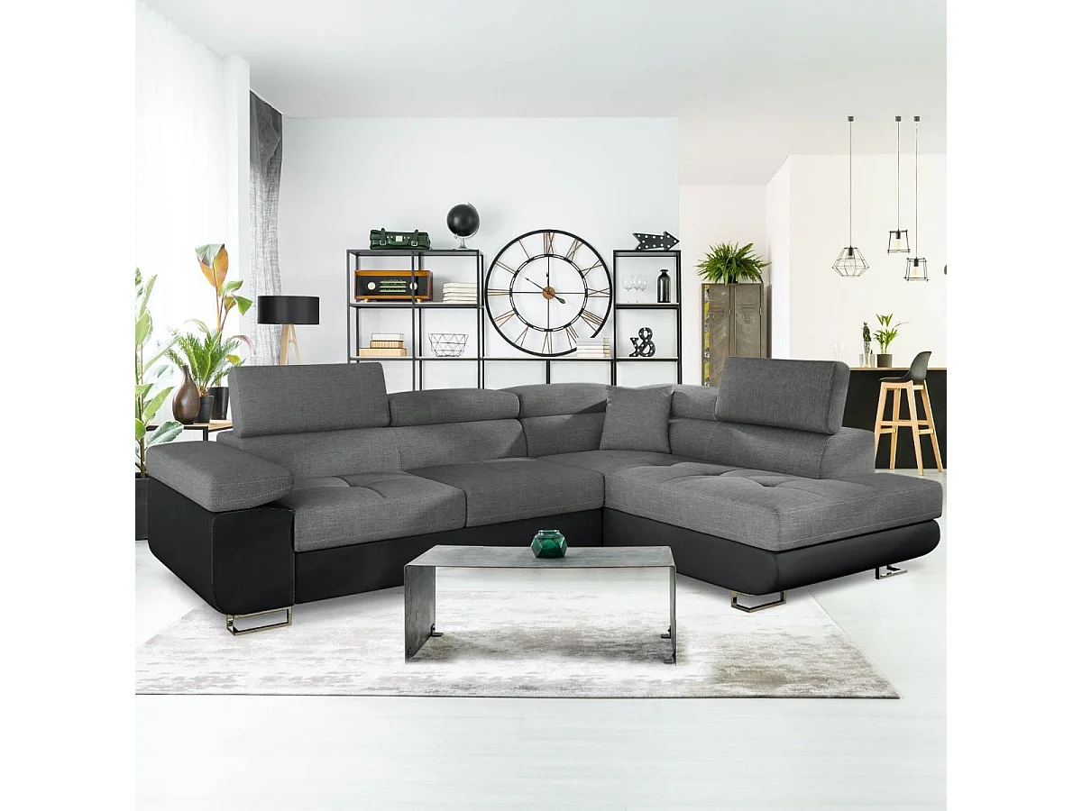 Divano ad angolo trasformabile Antoni con poggiatesta sollevabili in simil pelle nero e tessuto grigio scuro